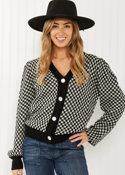 WJ Look the Part Large check puff shoulder cardigan.